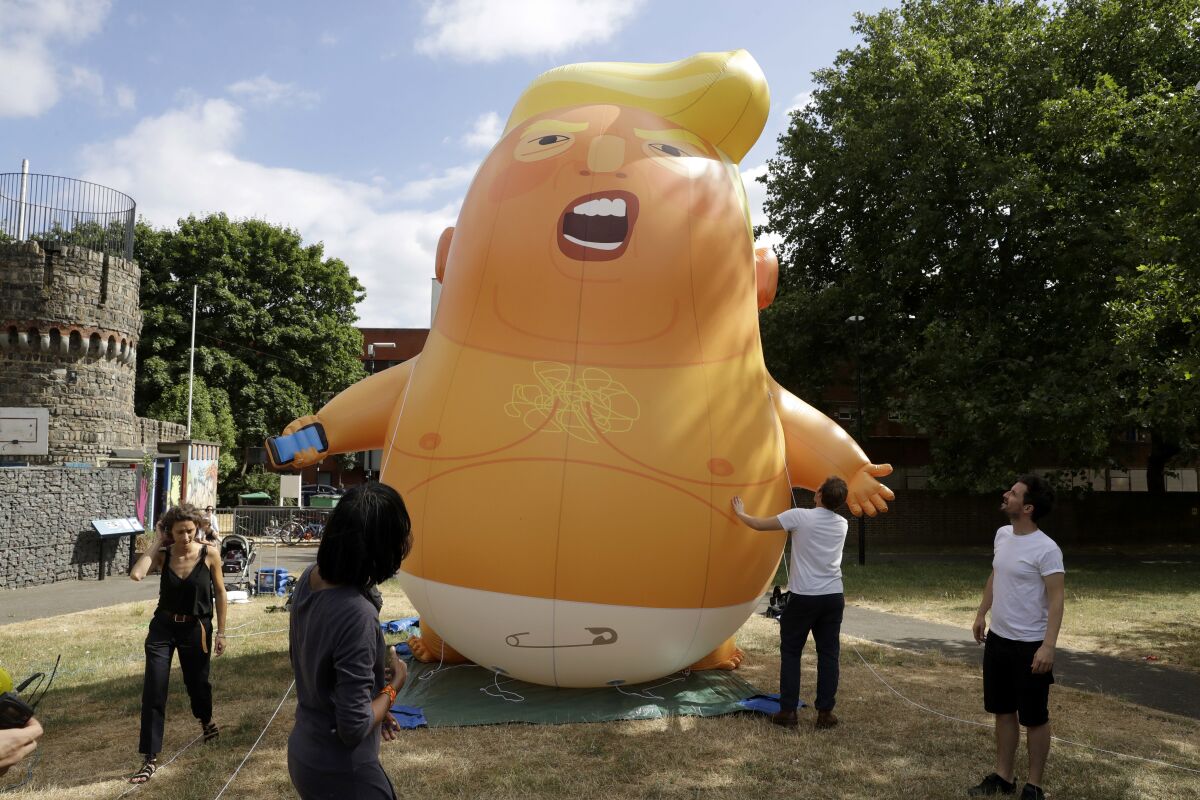 A 20-foot-tall protest balloon depicting President Trump as a diapered, petulant baby