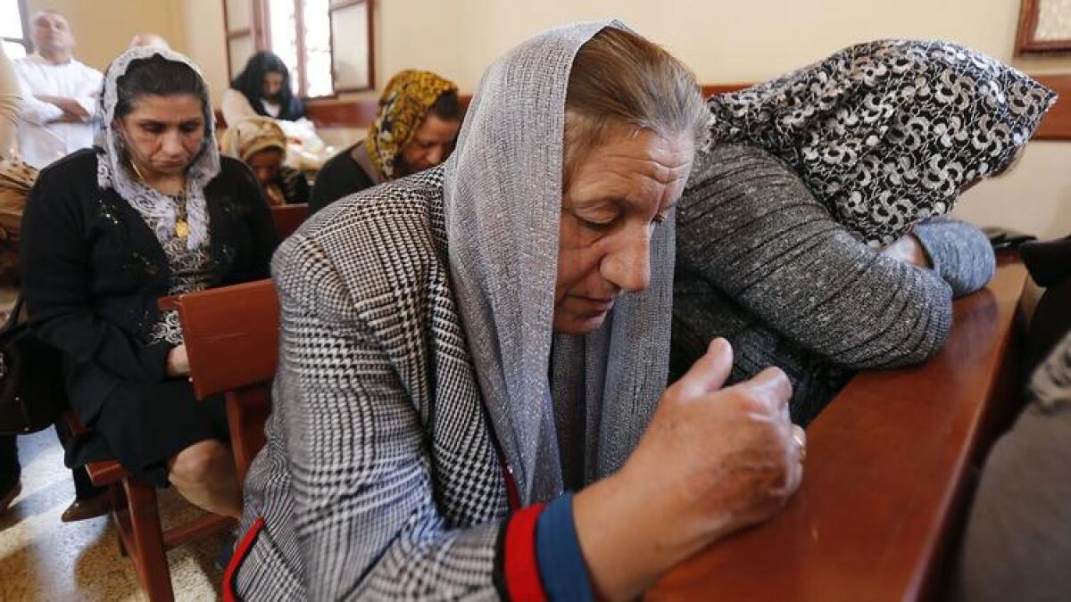 Assyrian Christians, who fled unrest in Syria and Iraq, attend Mass at St. George's Assyrian Church in Jdeideh, Lebanon. Trump's directive provides an exception for "religious minorities."