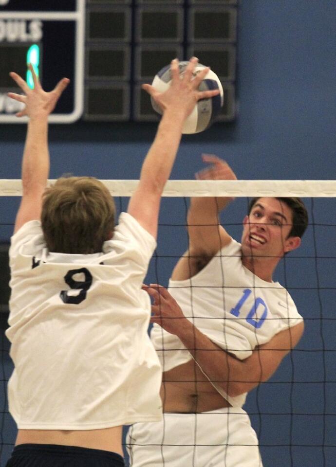 Corona del Mar High's Tommy Brooks (10) battles at the net in a nonleague match against Loyola in Newport Beach on Wednesday.