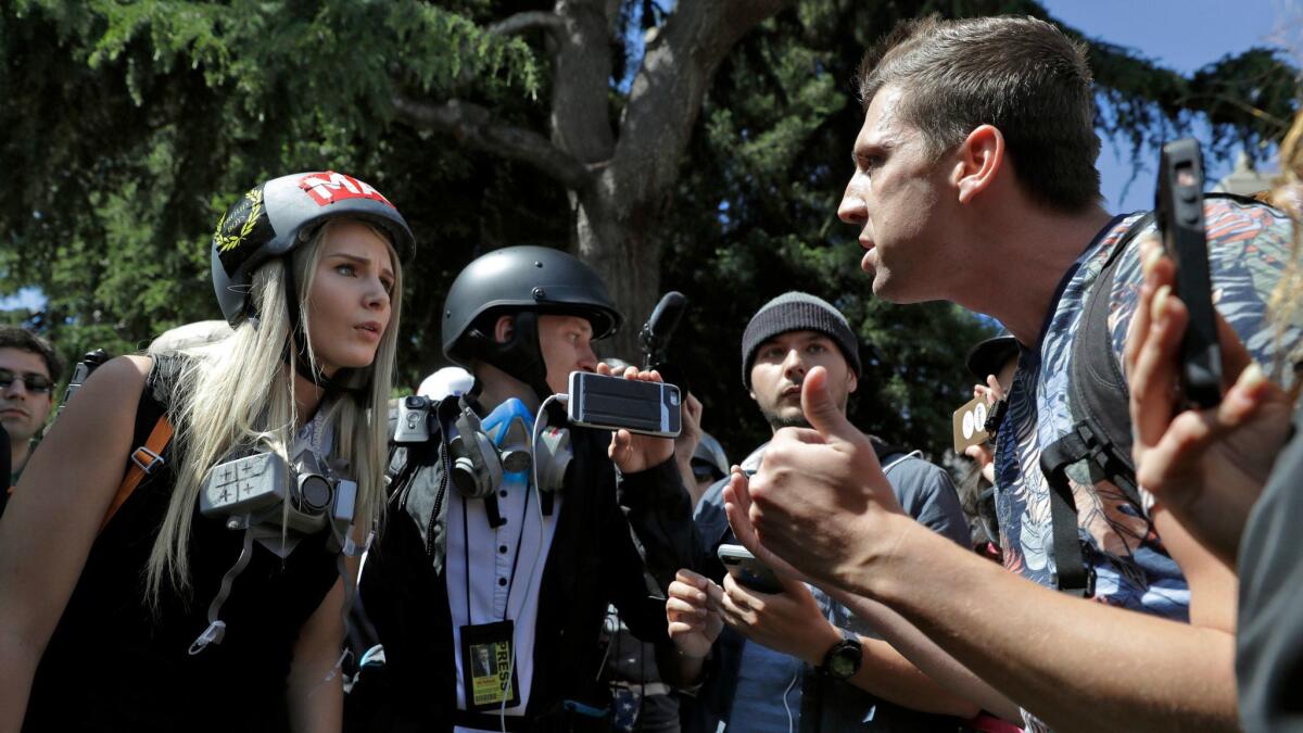 Demonstrators argue during a rally in Berkeley, Calif. to show support for free speech and to condemn the views of Ann Coulter and her supporters on April 27.