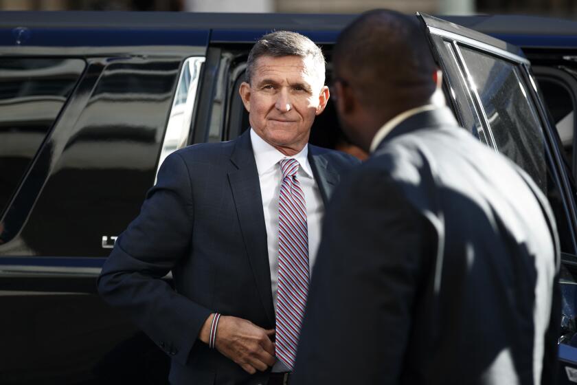 FILE - In this Dec. 18, 2018, file photo, President Donald Trump's former National Security Advisor Michael Flynn arrives at federal court in Washington. (AP Photo/Carolyn Kaster, File)