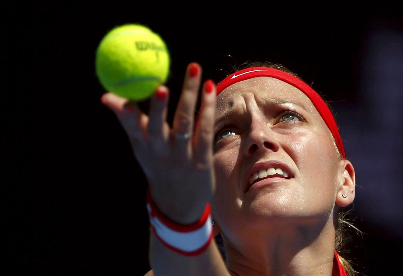 Czech Republic's Kvitova serves during her first round match against Thailand's Kumkhum at the Australian Open tennis tournament at Melbourne Park, Australia