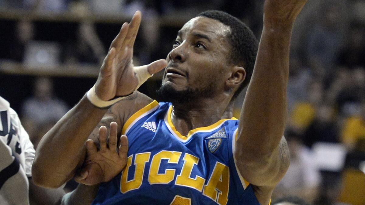 UCLA's Norman Powell puts up a shot during a loss to Colorado on Friday.