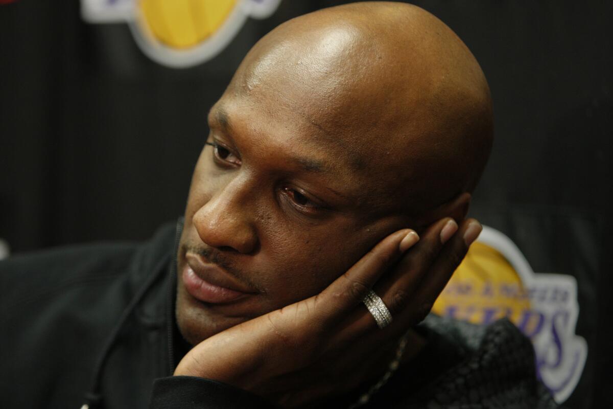 Lamar Odom answers questions during a Lakers press conference in 2011.