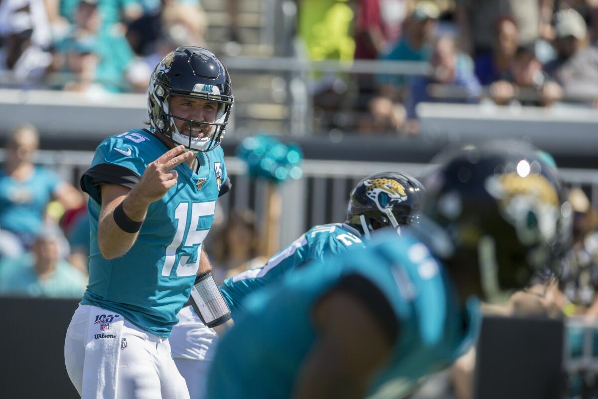 Jacksonville Jaguars quarterback Gardner Minshew (15) calls a play at the line of scrimmage against the New Orleans Saints during the first half on Sunday in Jacksonville, Fla.
