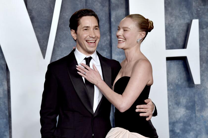 Justin Long, left, and Kate Bosworth arrive at the Vanity Fair Oscar Party on Sunday, March 12, 2023