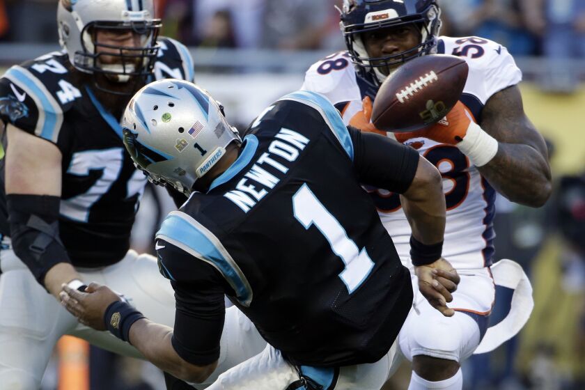 Broncos linebacker Von Miller (58) strips the ball from Panthers quarterback Cam Newton, leading to a fumble recovery for a touchdown by Malik Jackson (not pictured).