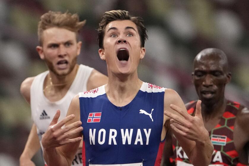 Jakob Ingebrigtsen, of Norway celebrates winning the gold medal in the final.