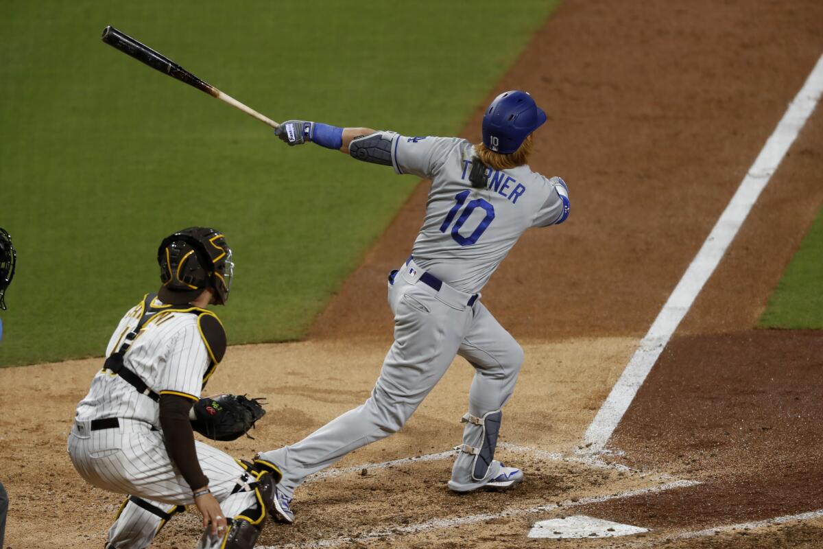 The Dodgers' Justin Turner connects for a solo home run in the ninth inning April 17, 2021.