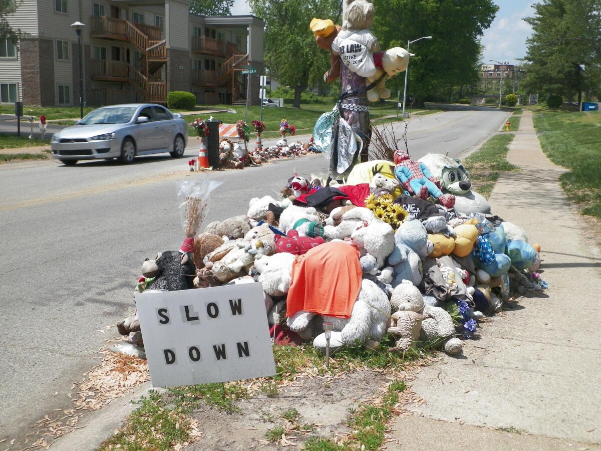 Two memorials to Michael Brown stand near where the unarmed, black 18-year-old was shot and killed last August by white Ferguson, Mo., Police Officer Darren Wilson.