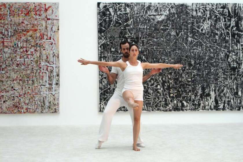 LA Dance Project's Benjamin Millepied performs at MOCA in July with dancer Amanda Wells in front of paintings by Mark Bradford.