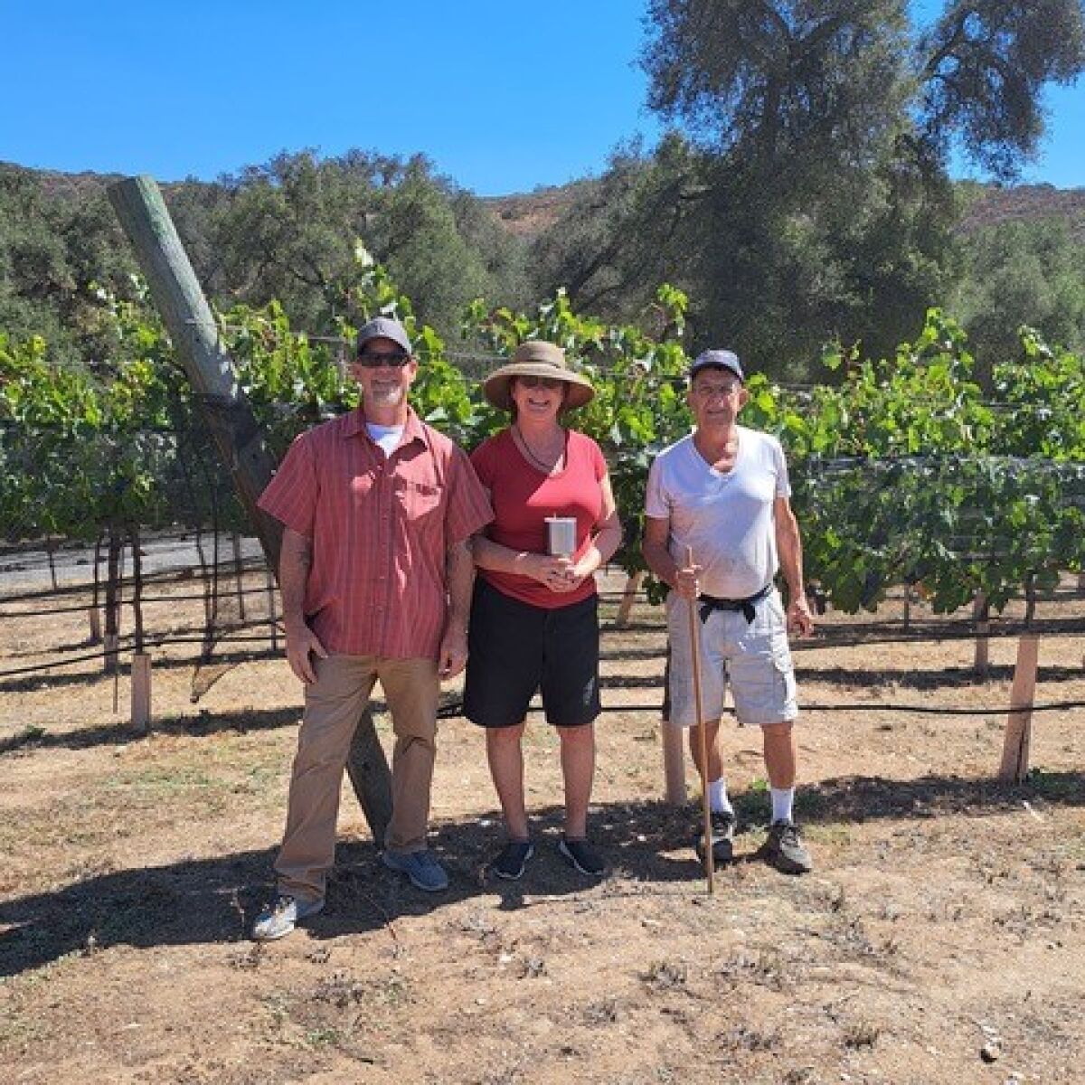 From left, Micole Moore, Teri Kerns and Joe Cahak prepare to explore Ramona Ranch Winery for rock specimens.