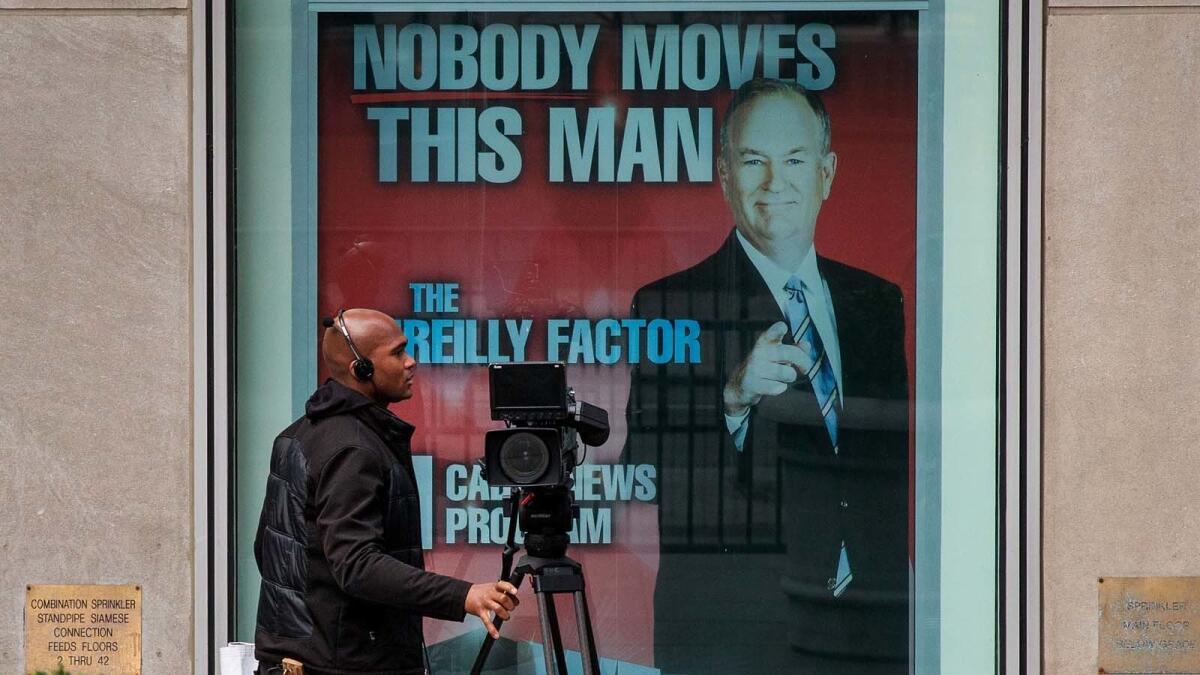 Bill O'Reilly's image adorns News Corp.'s New York City headquarters Wednesday.