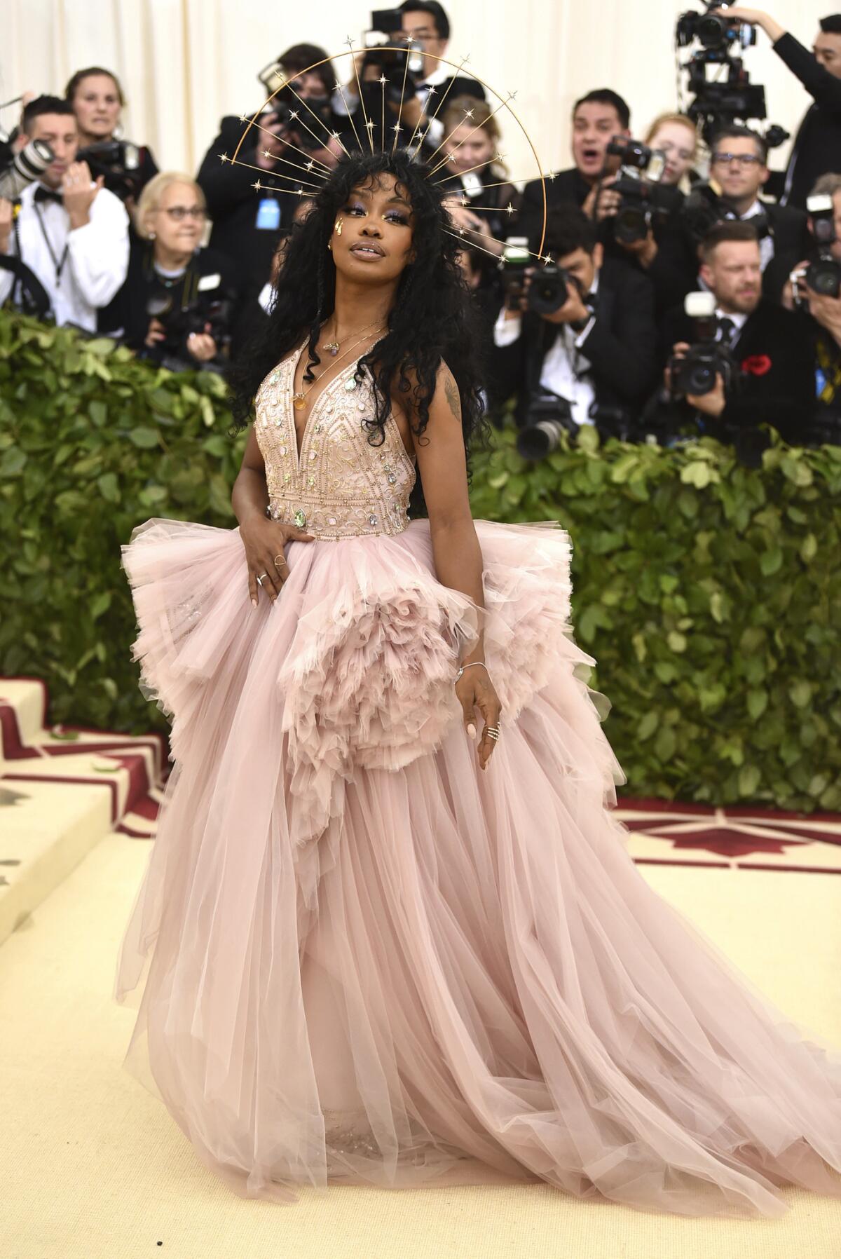 Sza sticks to the heavenly aspect of the 2018 Met Gala theme "Heavenly Bodies: Fashion and the Catholic Imagination."