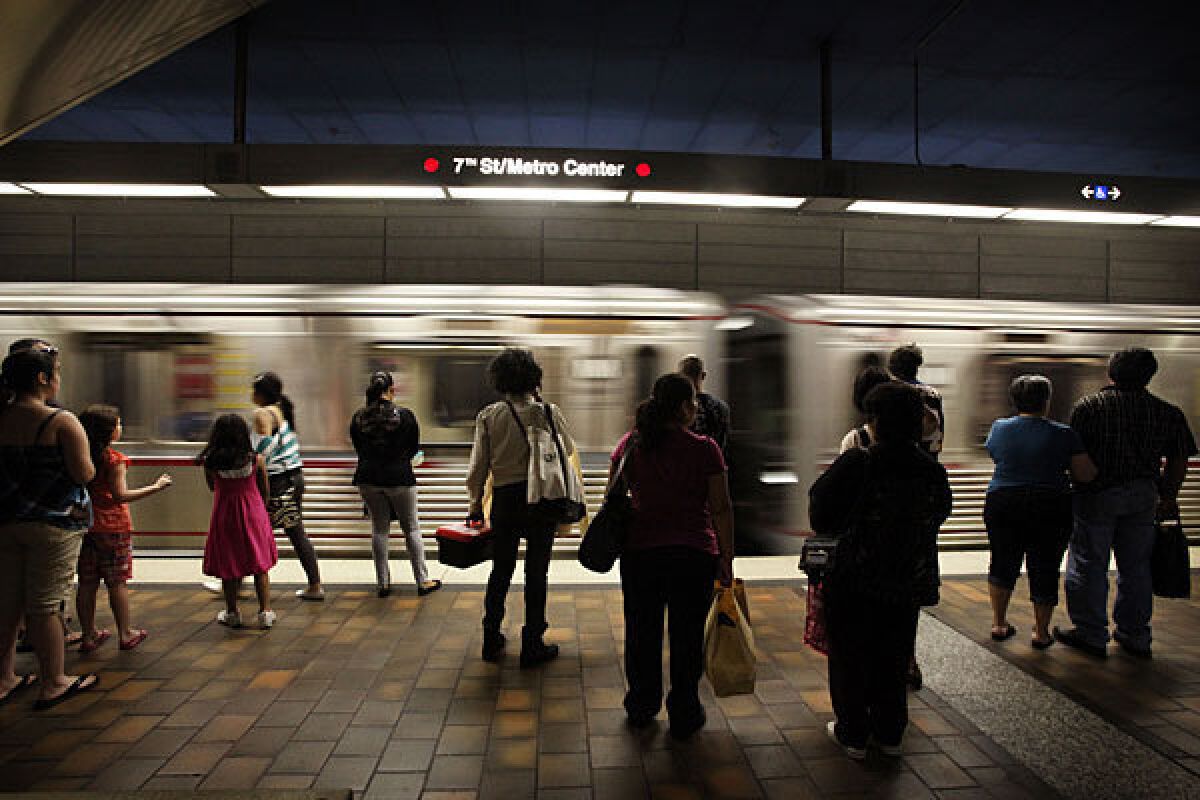 Subway passengers wait at a station in downtown Los Angeles.