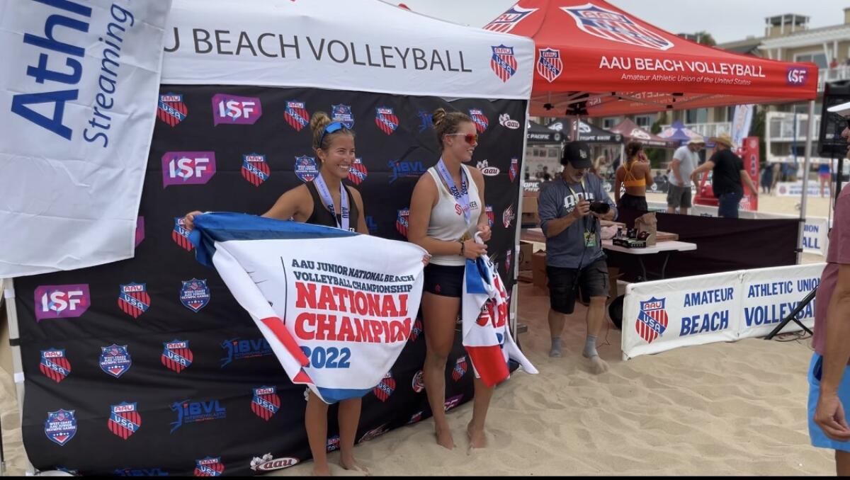 Huntington Beach's Danielle Sparks and Haylee LaFontaine pose for a photo after winning a 16U AAU tournament.