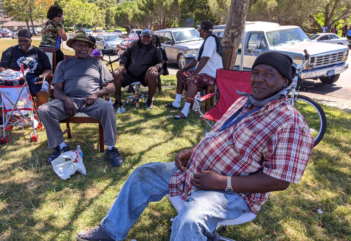 People sit under a tree