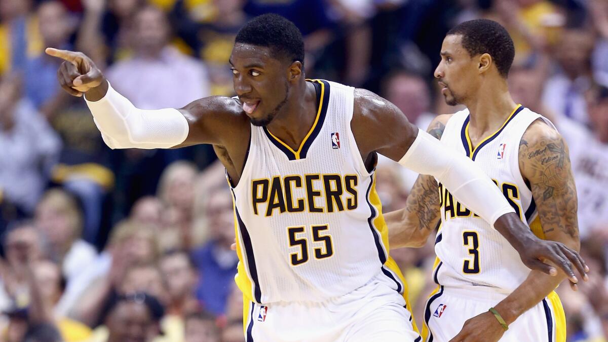 Indiana Pacers center Roy Hibbert celebrates after scoring a basket in a playoff game against the Washington Wizards in 2014.