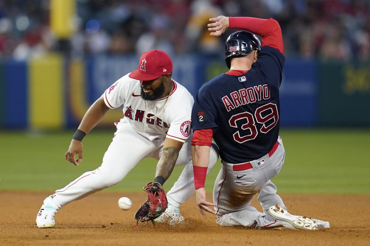 Boston Red Sox' Christian Arroyo steals second base ahead of a throw to Angels second baseman Luis Rengifo.