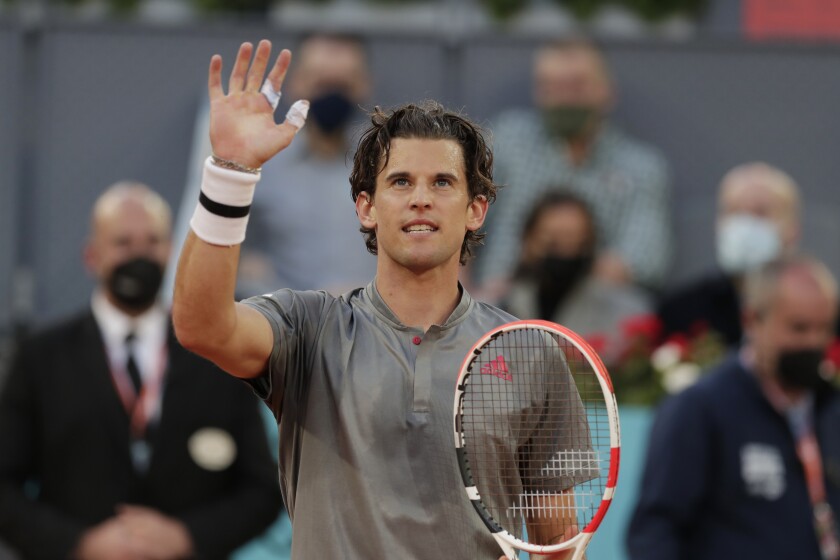 Dominic Thiem of Austria celebrates after defeating Marcos Giron of the U.S. 6-1, 6-3 during their match at the Madrid Open tennis tournament in Madrid, Spain, Tuesday, May 4, 2021. (AP Photo/Paul White)
