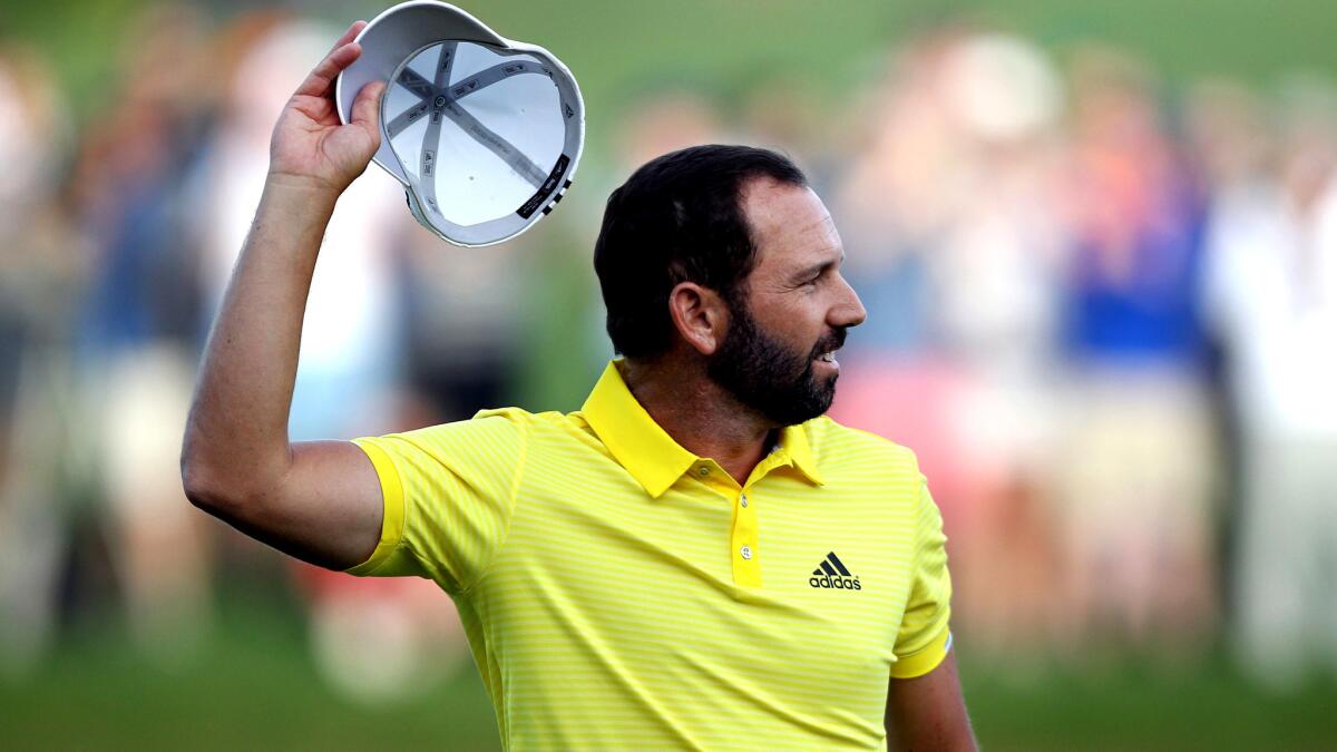 Sergio Garcia acknowledges the cheers after finishing the final round of the Dubai Desert Classic on Sunday.