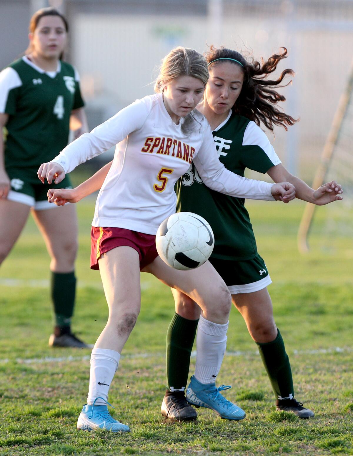 La Canada High School girls soccer player Grace Patton keeps the defender away from the ball in game vs. Temple City High in Temple City on Wednesday, Jan. 22, 2020.