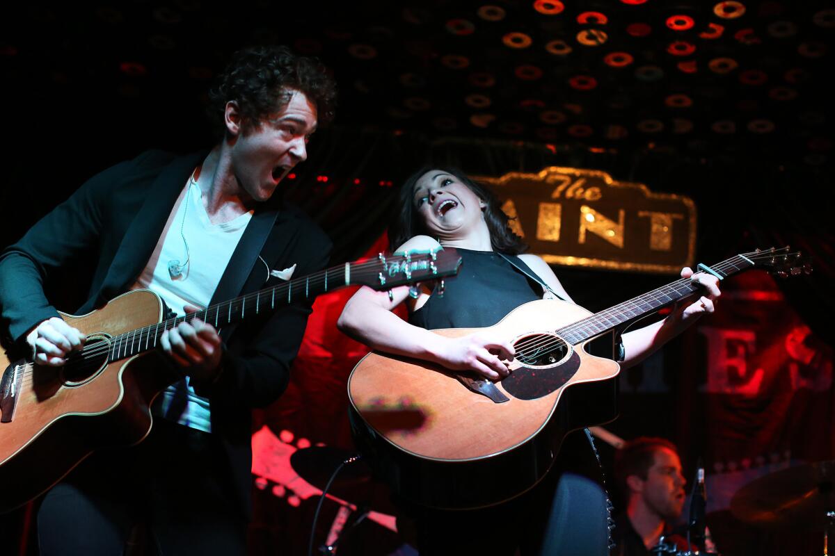 Justin Davis and Sarah Zimmerman of Striking Matches perform Wednesday night at the Mint in Los Angeles.