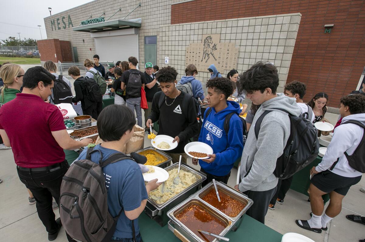 Varsity athletes line up to get lunch during the All-Sports Cup luncheon at Costa Mesa High on Wednesday.