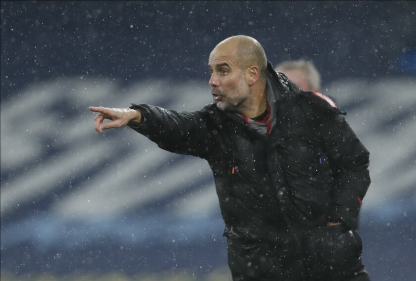 Manchester City's head coach Pep Guardiola gives instructions during the English Premier League soccer match between Manchester City and Newcastle United at the Etihad Stadium in Manchester, England, Saturday, Dec., 26, 2020. (Clive Brunskill/ Pool via AP)
