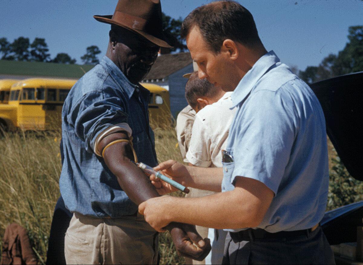 A man included in the syphilis study received an injection in the 1950s in Tuskegee.