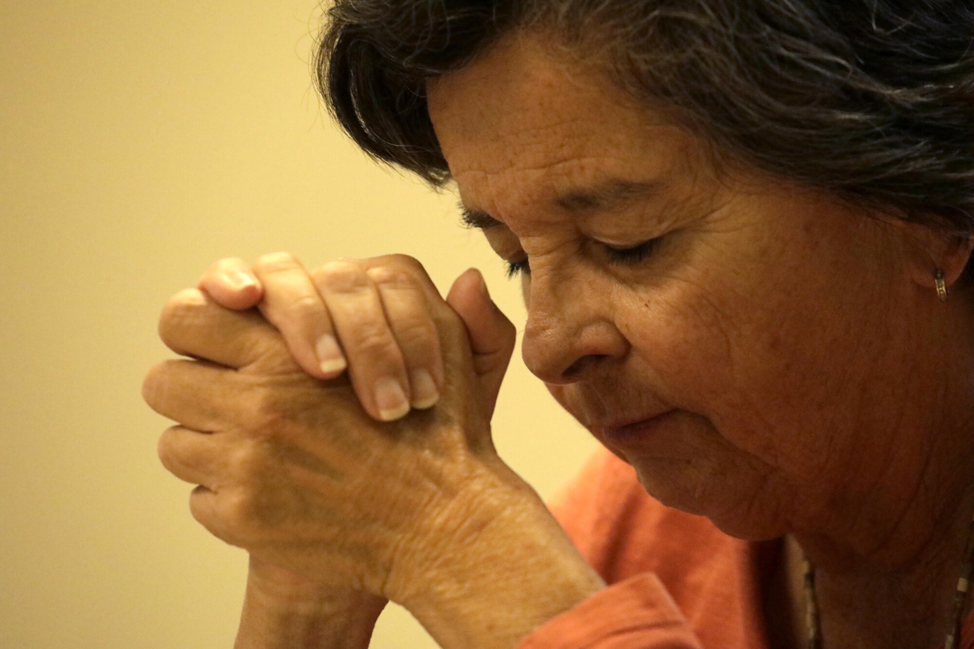 Martha Olivares prays during a monthly meeting of St. Dymphna's Disciples in Yorba Linda.