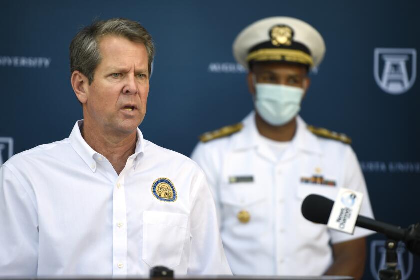 Georgia Gov. Brian Kemp speaks at the Georgia Cancer Center in Augusta, Ga., Thursday, July 2, 2020, as part of his "Wear a Mask" Fly-Around Tour to promote the wearing of masks as COVID numbers rise in Georgia. (Michael Holahan/The Augusta Chronicle via AP)