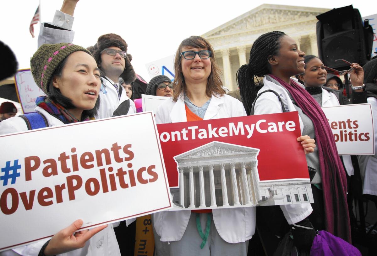 Supporters of the Affordable Care Act gather in front of the U.S. Supreme Court during a rally Wednesday in Washington.