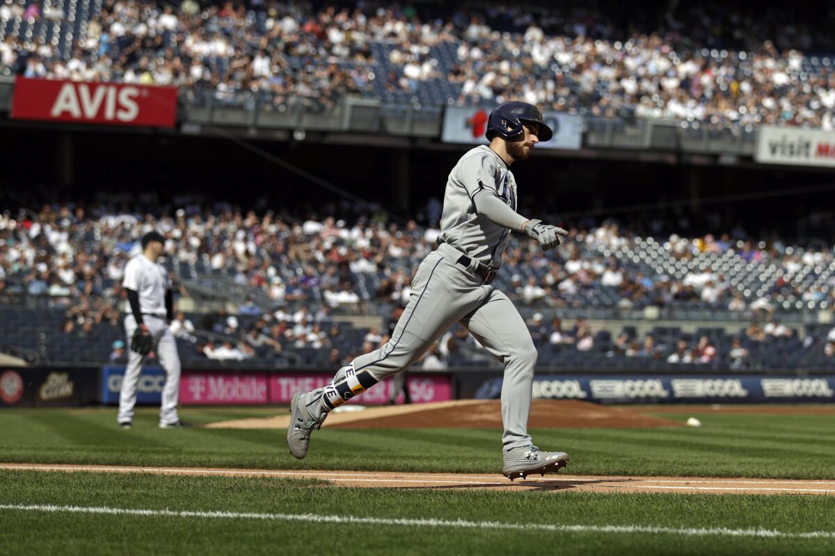 Tampa Bay Rays' Brandon Lowe rounds first base after hitting a 3-run home run during the first inning of a baseball game off of New York Yankees pitcher Jordan Montgomery on Saturday, Oct. 2, 2021, in New York. (AP Photo/Adam Hunger)
