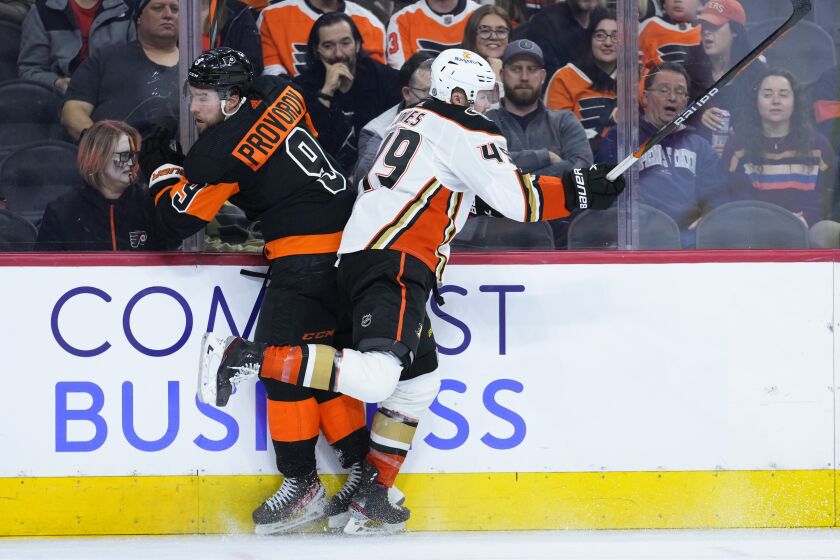 Philadelphia Flyers' Ivan Provorov, left, and Anaheim Ducks' Max Jones collide during the third period of an NHL hockey game