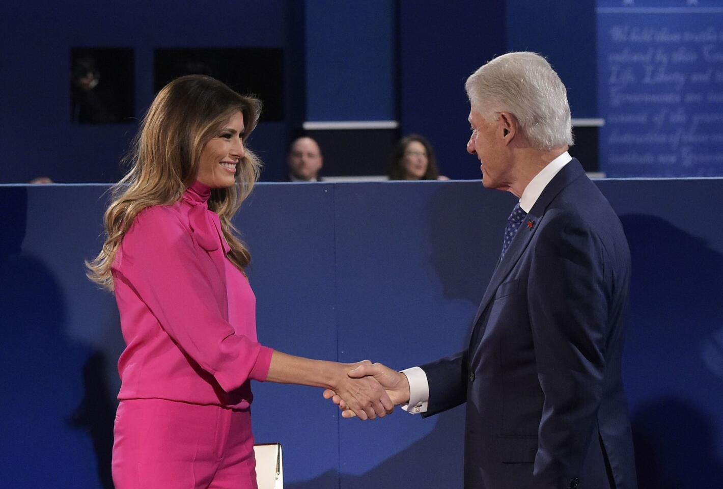 Melania shakes hands with Bill Clinton