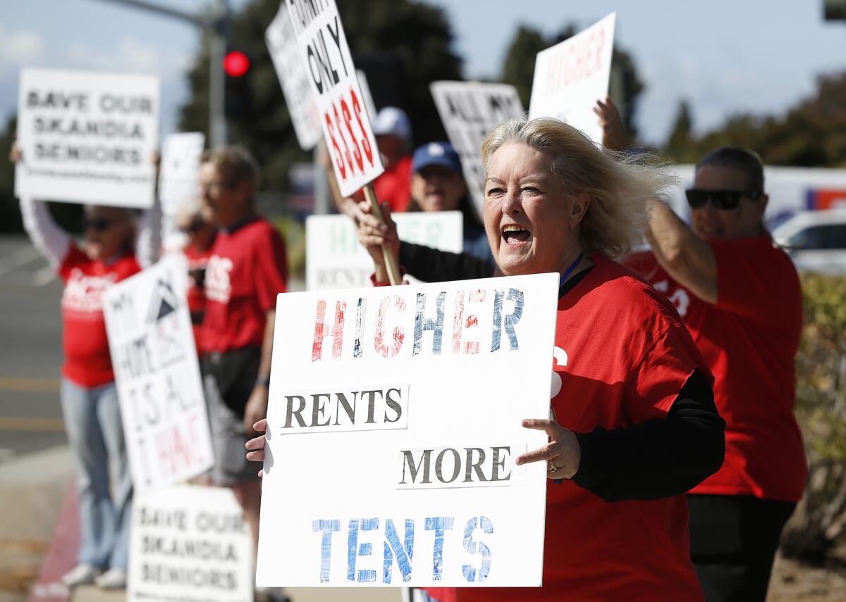 Teri Williams joins others in a Mobile Home Resident Coalition rally.