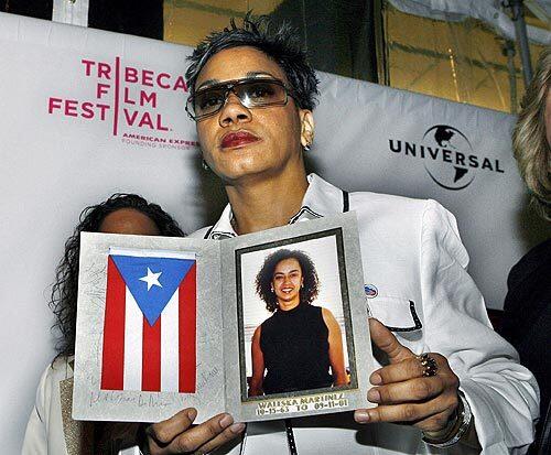 Lourdes LeBron holds a picture of her sister Waleska Martinez, who lost her life on United Flight 93, on the red carpet at the World Premiere of 'UNITED 93' on the opening night of the 5th Annual Tribeca Film Festival in New York City.