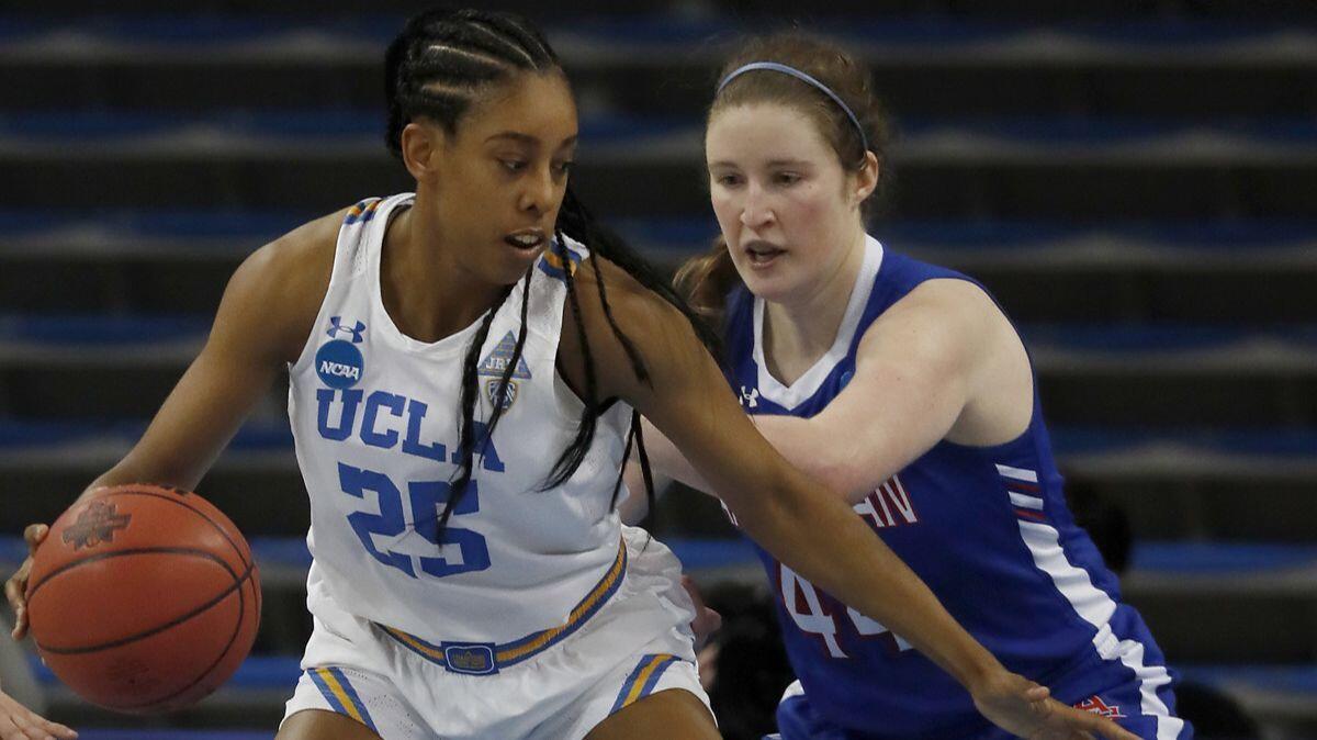 UCLA forward Monique Billings scores 20 points against Cecily Carl and American on Saturday at Pauley Pavilion.