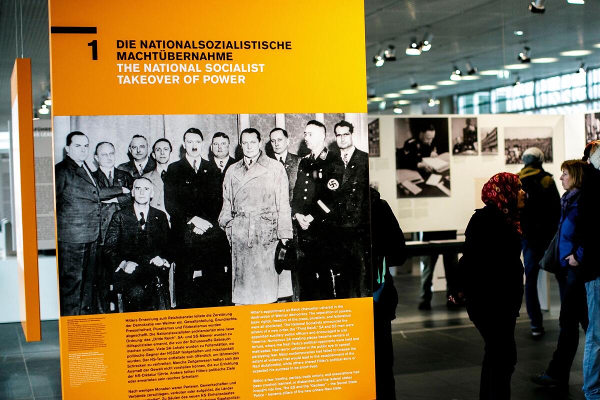 A Berlin museum exhibit on Jan 27, Holocaust Remembrance Day, displays a photograph of Nazi leaders, including Adolf Hitler.