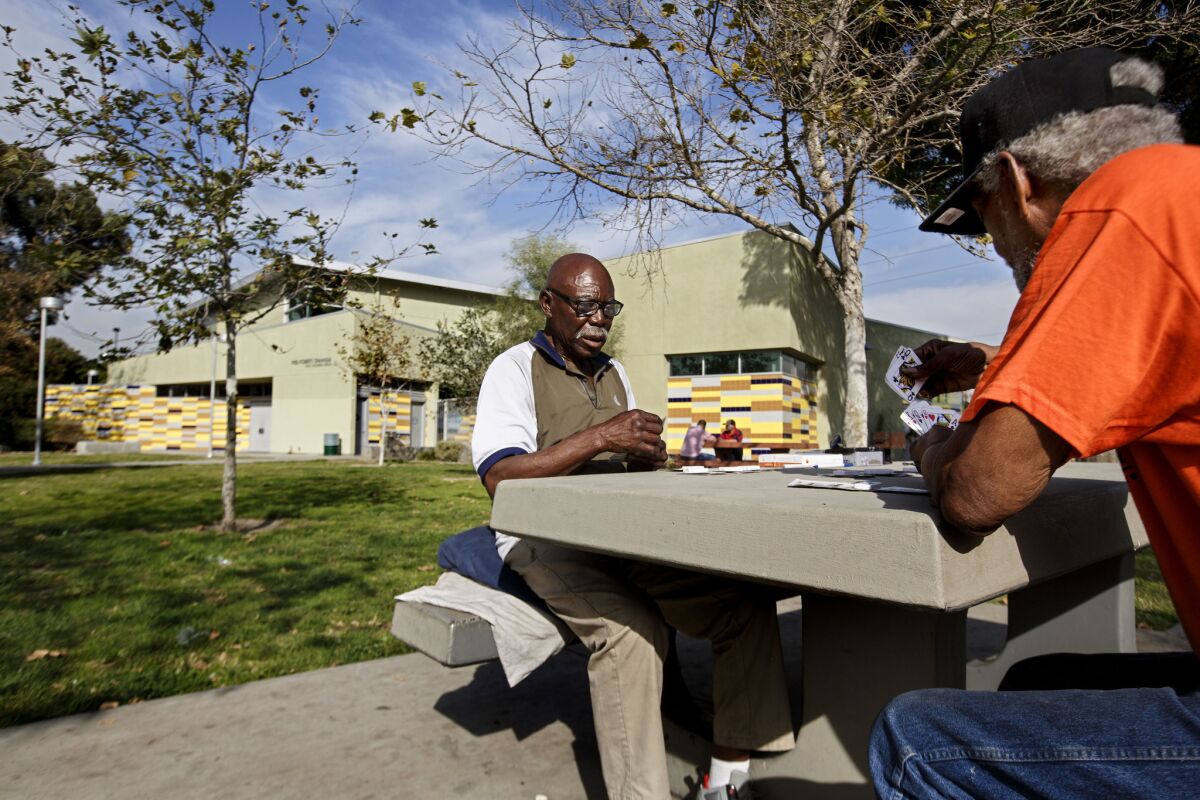 Mack Henry Conley, left, and Michael Jewell play pinochle in January at Fred Roberts Recreation Center in South Los Angeles, an area that is among the most park-poor parts of L.A. County.