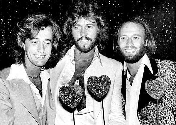 The Bee Gees, from left, Robin, Barry and Maurice Gibb, attend a party following the Hollywood premiere of "Sgt. Pepper's Lonely Hearts Club Band" on July 31, 1978.