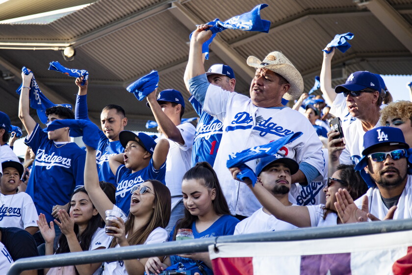 California will fully reopen Tuesday. What will change as
the pandemic fades? 3 LOS ANGELES, CA - OCTOBER 3, 2019: Dodger fans cheer as the Dodgers starting line-up.