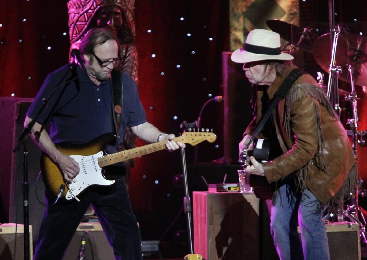 Neil Young, at right with Stephen Stills during Buffalo Springfield's 2011 reunion show in Los Angeles, will headline the third Light Up the Blues benefit for Autism Speaks, organized by Stills and his wife, Kristen. The show is Saturday, April 25, at the Pantages Theatre in Hollywood.
