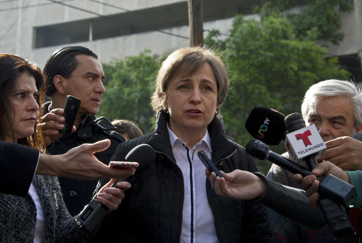 Mexican journalist Carmen Aristegui speaks to journalists in Mexico City on Tuesday, the day after she was fired.