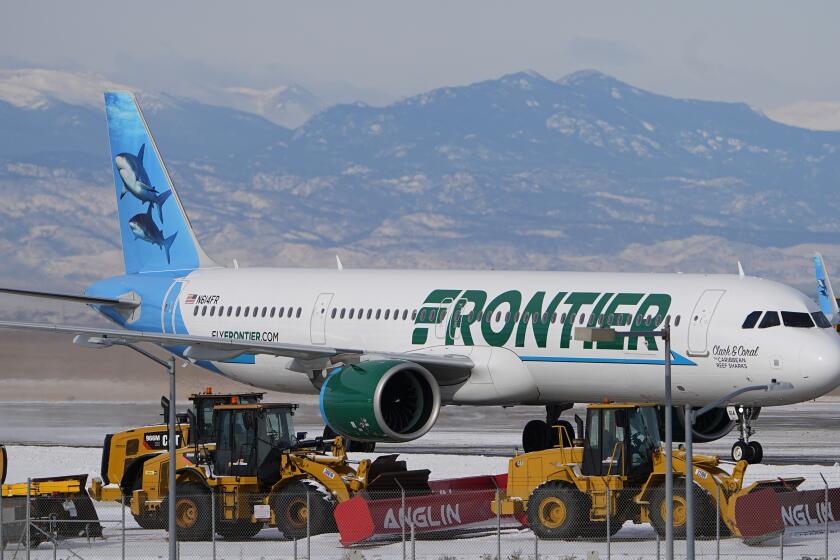 FILE 0 A Frontier Airlines jetliner arrives at Denver International Airport, Tuesday, Jan. 16, 2024, in Denver. Frontier Airlines, which has struggled more than other U.S. carriers to recover from the pandemic, says it is eliminating change fees on some tickets and creating four fare classes to boost its appeal to more travelers. (AP Photo/David Zalubowski, File)