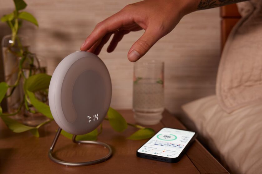 This image provided by Amazon shows the Halo Rise bedside smart alarm. The e-commerce and tech giant said Wednesday, Sept. 28, 2022, that it will start selling the device later this year. Halo Rise will be able to track sleeping patterns without a wristband by using no-contact sensors and artificial intelligence to measure a user’s movement and breathing patterns, according to Amazon. (Amazon via AP)