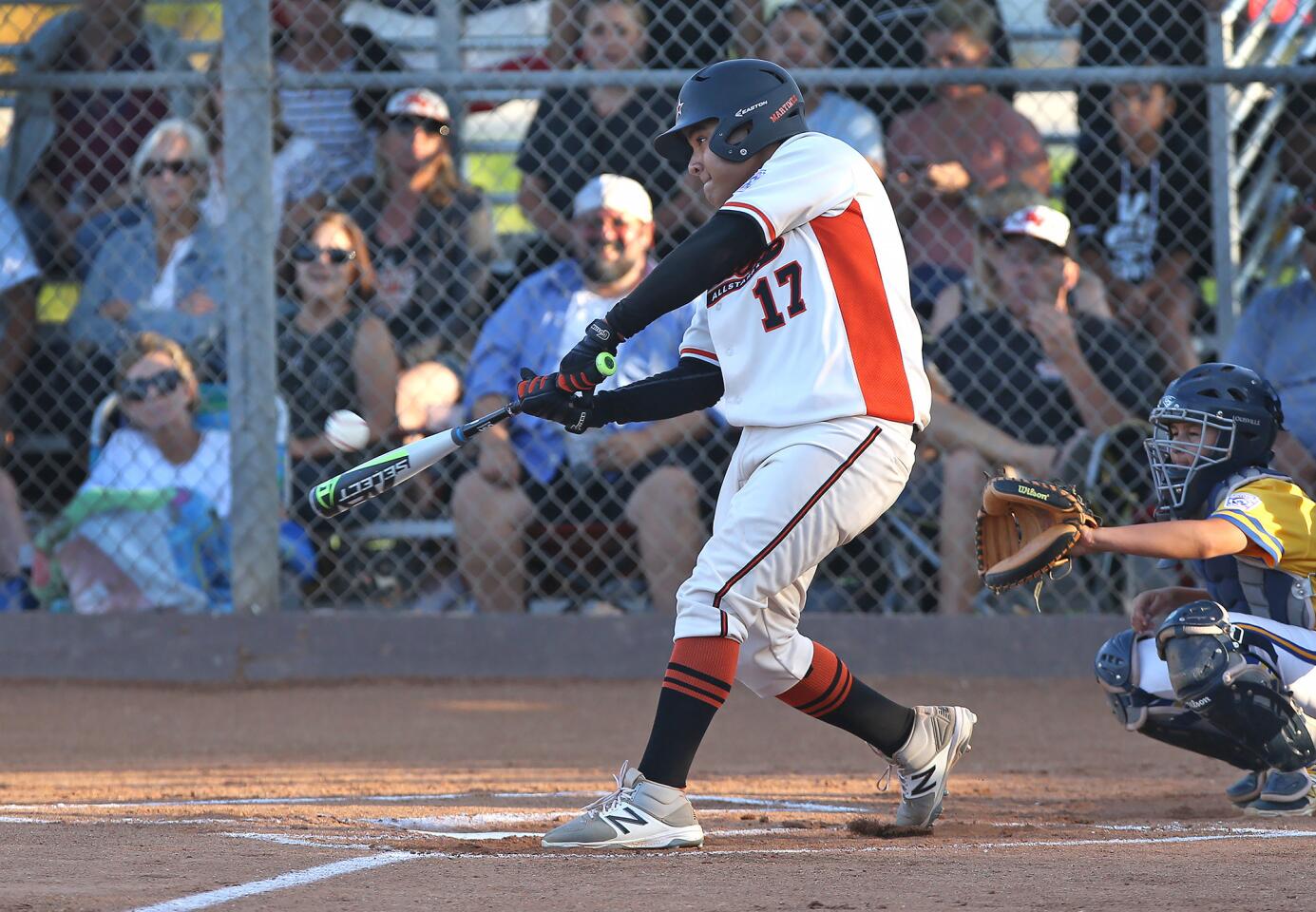 Huntington Valley slugger Tony Martinez hits a grand slam in the elimination game against El Segundo in the Little League All-Stars Southern California Divisional Tournament on Thursday.