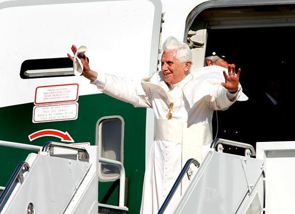The pontiff greets the crowd at Andrews Air Force Base. His six-day visit to Washington and New York will include talks with President Bush and a speech at the United Nations.