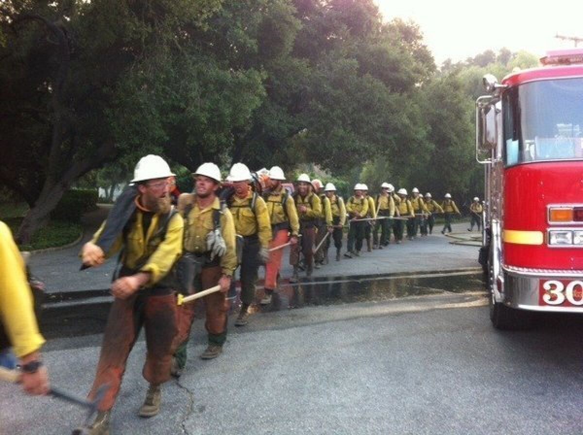 Firefighters head out to battle the Springs fire in Ventura County's Hidden Valley.
